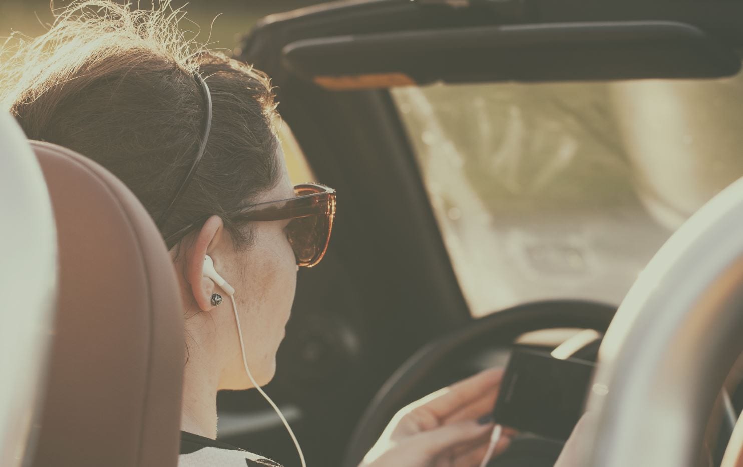 Can I use headphones when driving?